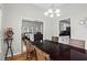 Cozy dining room with hardwood floors, modern light fixture and views of the kitchen and living room at 1923 Hamby Place Nw Dr, Acworth, GA 30102