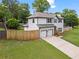Beautiful two-story home with a spacious driveway, manicured lawn, and fenced yard at 1923 Hamby Place Nw Dr, Acworth, GA 30102