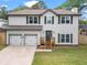 Charming two-story home featuring a welcoming front porch and a well-manicured lawn at 1923 Hamby Place Nw Dr, Acworth, GA 30102