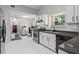 Clean and modern kitchen with stainless steel appliances and white cabinetry at 1923 Hamby Place Nw Dr, Acworth, GA 30102