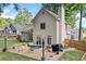 This backyard features an outdoor patio, landscaping, a well-manicured lawn, and plenty of space for outdoor activities at 3376 Hickory Ln, Powder Springs, GA 30127