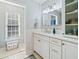 Bright bathroom featuring white cabinets, subway tile, and modern fixtures at 3376 Hickory Ln, Powder Springs, GA 30127
