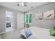 Bedroom with ensuite bath and closet with large window and light grey wall color at 3376 Hickory Ln, Powder Springs, GA 30127