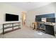 Spacious bedroom with multiple monitors, TV console and access to ensuite bath at 3376 Hickory Ln, Powder Springs, GA 30127