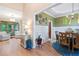Elegant dining room featuring hardwood floors, decorative trim, and views of the living area at 3376 Hickory Ln, Powder Springs, GA 30127