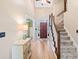 Inviting foyer with gleaming hardwood floors and a staircase leading to the upper level at 3376 Hickory Ln, Powder Springs, GA 30127