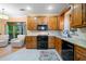 Stylish kitchen with updated appliances, and wooden cabinets offering abundant storage at 3376 Hickory Ln, Powder Springs, GA 30127