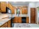 Kitchen featuring granite counters, stainless appliances, and a wooden cabinets at 3376 Hickory Ln, Powder Springs, GA 30127