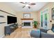 Comfortable living room with fireplace, entertainment center, and access to the backyard at 3376 Hickory Ln, Powder Springs, GA 30127