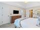 Spacious main bedroom with a large bed, dresser, and walk-in closet access at 3376 Hickory Ln, Powder Springs, GA 30127