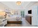 Serene main bedroom featuring a vaulted ceiling, king bed, and ensuite bathroom at 3376 Hickory Ln, Powder Springs, GA 30127