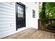 Exterior view of the home with a wooden deck and black door at 398 Nw Wester Blvd, Atlanta, GA 30314