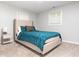 Cozy bedroom with natural light, neutral carpet and blue bedding at 398 Nw Wester Blvd, Atlanta, GA 30314