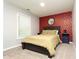 Bedroom with neutral carpet, red patterned wallpaper and dark wood furniture at 398 Nw Wester Blvd, Atlanta, GA 30314