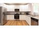 Well-lit kitchen with white cabinets, stainless steel appliances, and granite countertops at 398 Nw Wester Blvd, Atlanta, GA 30314
