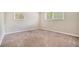 Bright, carpeted bedroom with two windows at 4004 Knightsbridge Nw Rd, Kennesaw, GA 30144