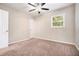 Bedroom with ceiling fan, carpet, neutral paint and well lit window at 4004 Knightsbridge Nw Rd, Kennesaw, GA 30144
