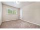 Cozy bedroom with neutral walls, plush carpet, and a bright window view at 4004 Knightsbridge Nw Rd, Kennesaw, GA 30144