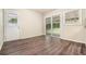 Open living space with door to backyard and large sliding glass doors at 4004 Knightsbridge Nw Rd, Kennesaw, GA 30144