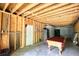 Unfinished basement featuring exposed framing, a pool table, and potential for customization at 547 Ellington Rd, Oxford, GA 30054