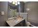 Bathroom featuring a vanity with a white sink and toilet at 547 Ellington Rd, Oxford, GA 30054