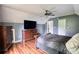 Bedroom featuring hardwood floors, ceiling fan and dresser at 547 Ellington Rd, Oxford, GA 30054