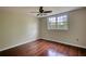 This bedroom has a ceiling fan, light hardwood floors and a window at 547 Ellington Rd, Oxford, GA 30054