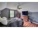 Bedroom with hardwood floors and ceiling fan at 547 Ellington Rd, Oxford, GA 30054