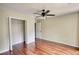 Bedroom featuring hardwood floors, closet and a ceiling fan at 547 Ellington Rd, Oxford, GA 30054