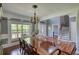 Spacious dining room featuring natural light, a chandelier and hardwood floors at 547 Ellington Rd, Oxford, GA 30054