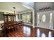 Elegant foyer with high ceilings, hardwood floors, and a decorative front door at 547 Ellington Rd, Oxford, GA 30054
