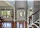 Two story foyer with hardwood floors, a decorative front door and grand staircase at 547 Ellington Rd, Oxford, GA 30054