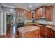 Spacious kitchen featuring wooden cabinetry, stainless oven and a center island at 547 Ellington Rd, Oxford, GA 30054
