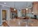 Kitchen with stainless steel appliances, granite countertops, and wood cabinets at 547 Ellington Rd, Oxford, GA 30054