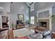 Spacious living room with a stone fireplace and views of the main bedroom at 547 Ellington Rd, Oxford, GA 30054