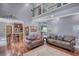 Open concept living room with a view of the kitchen and staircase at 547 Ellington Rd, Oxford, GA 30054