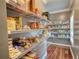 Well-organized pantry with multiple shelves fully stocked with food items at 547 Ellington Rd, Oxford, GA 30054