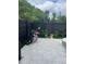 Cozy backyard featuring a tiled patio, dark wood fence, and well-maintained landscaping at 1805 Ashborough Se Cir # D, Marietta, GA 30067