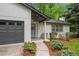 Charming single-story home features a welcoming entrance, manicured landscaping, and a convenient attached garage at 1965 Stilesboro Nw Dr, Kennesaw, GA 30152