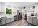 Modern kitchen with stainless steel appliances, farmhouse sink, and white and grey cabinetry at 1965 Stilesboro Nw Dr, Kennesaw, GA 30152