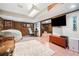 Finished basement recreation room features wood paneling, a large area rug, and a desk at 1965 Stilesboro Nw Dr, Kennesaw, GA 30152