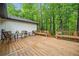 Relaxing wooden deck with outdoor seating overlooks the private backyard at 1965 Stilesboro Nw Dr, Kennesaw, GA 30152