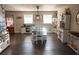 Bright dining room features hardwood floors, modern light fixture and white cabinets at 4076 Airline, Mcdonough, GA 30252