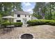 Spacious backyard featuring a patio, garden area, and mature trees, ideal for outdoor enjoyment at 4468 Whitt Station Nw Run, Acworth, GA 30101