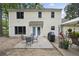 Charming backyard featuring a patio, outdoor seating, and well-maintained landscaping at 4468 Whitt Station Nw Run, Acworth, GA 30101