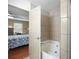 Bedroom view of a luxurious bathroom including a soaking tub and tiled walls and floors at 4468 Whitt Station Nw Run, Acworth, GA 30101