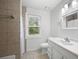 The well-lit bathroom includes tiled shower, vanity with sink, and ample storage at 4468 Whitt Station Nw Run, Acworth, GA 30101