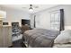 Spacious bedroom with dark wood floors, large bed, and windows offering natural light at 4468 Whitt Station Nw Run, Acworth, GA 30101