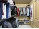 Walk-in closet boasts extensive shelving and racks for maximum storage and organization at 4468 Whitt Station Nw Run, Acworth, GA 30101