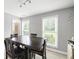 Bright dining area features new flooring, grey walls, and natural light from large windows at 4468 Whitt Station Nw Run, Acworth, GA 30101